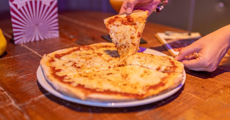Pizza and Drink at Trapeze bar and club - A Fun Experience!